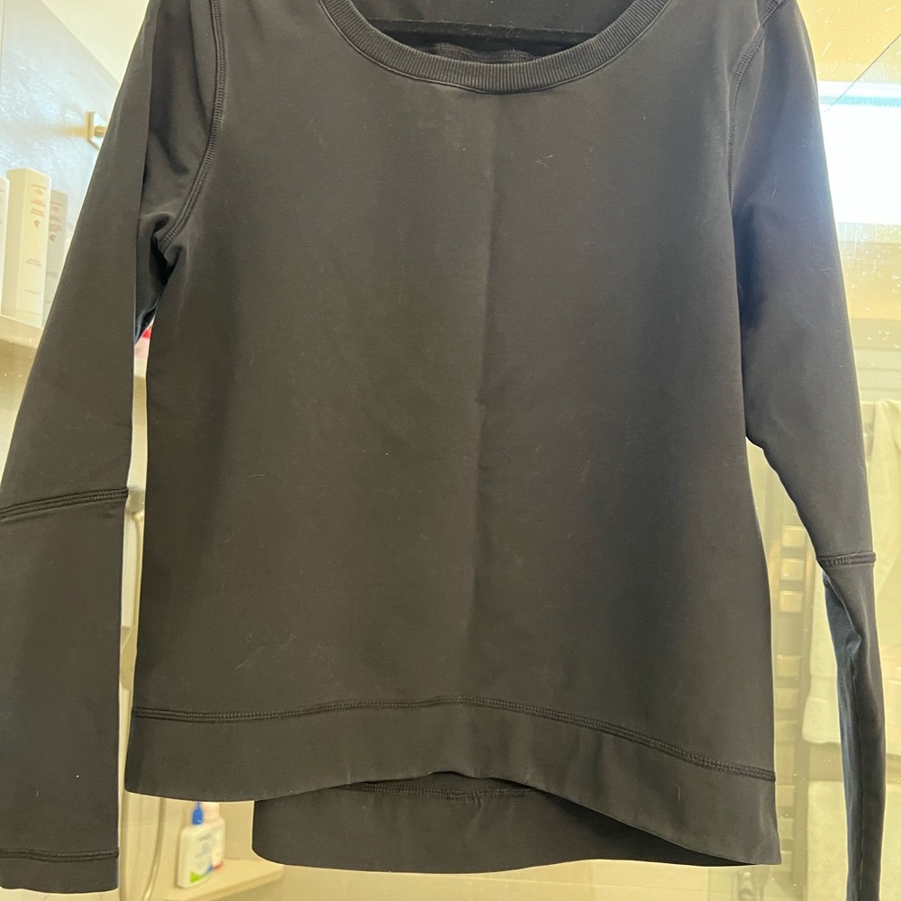 Lululemon woman’s size 8 black sweatshirt / pleat center back